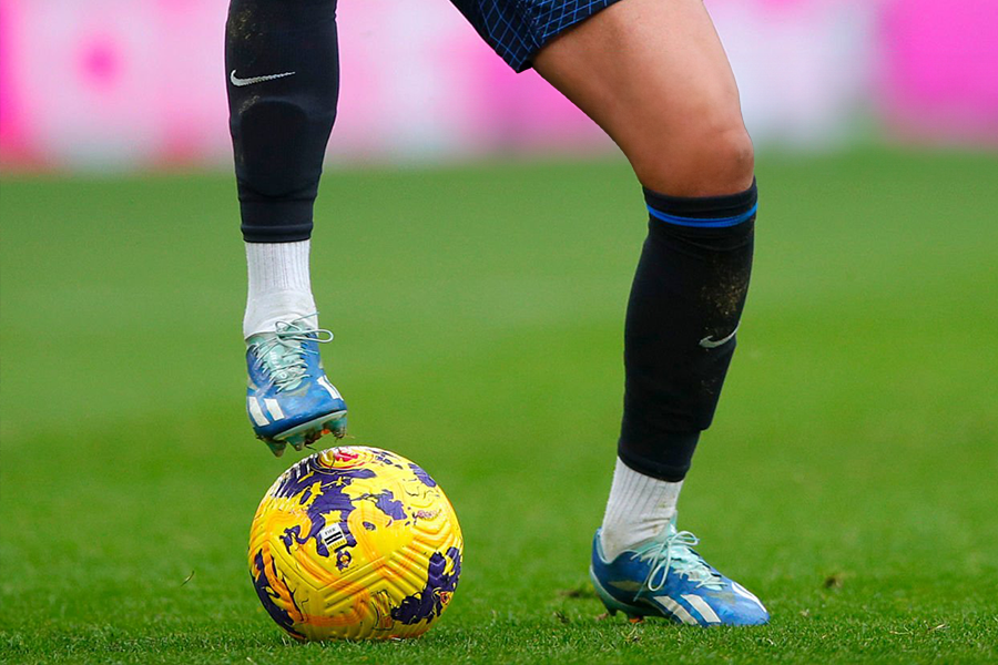 Why do football players cut their socks?